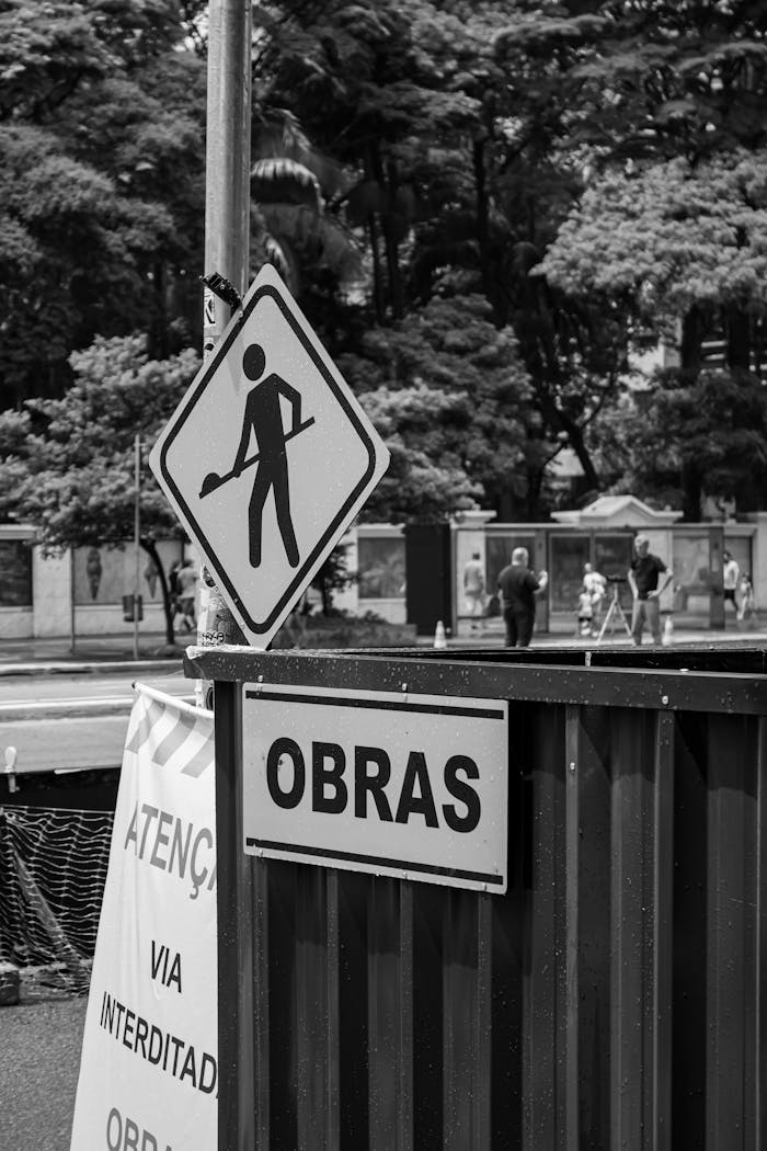 Black and White Photography of the Obras Street Sign